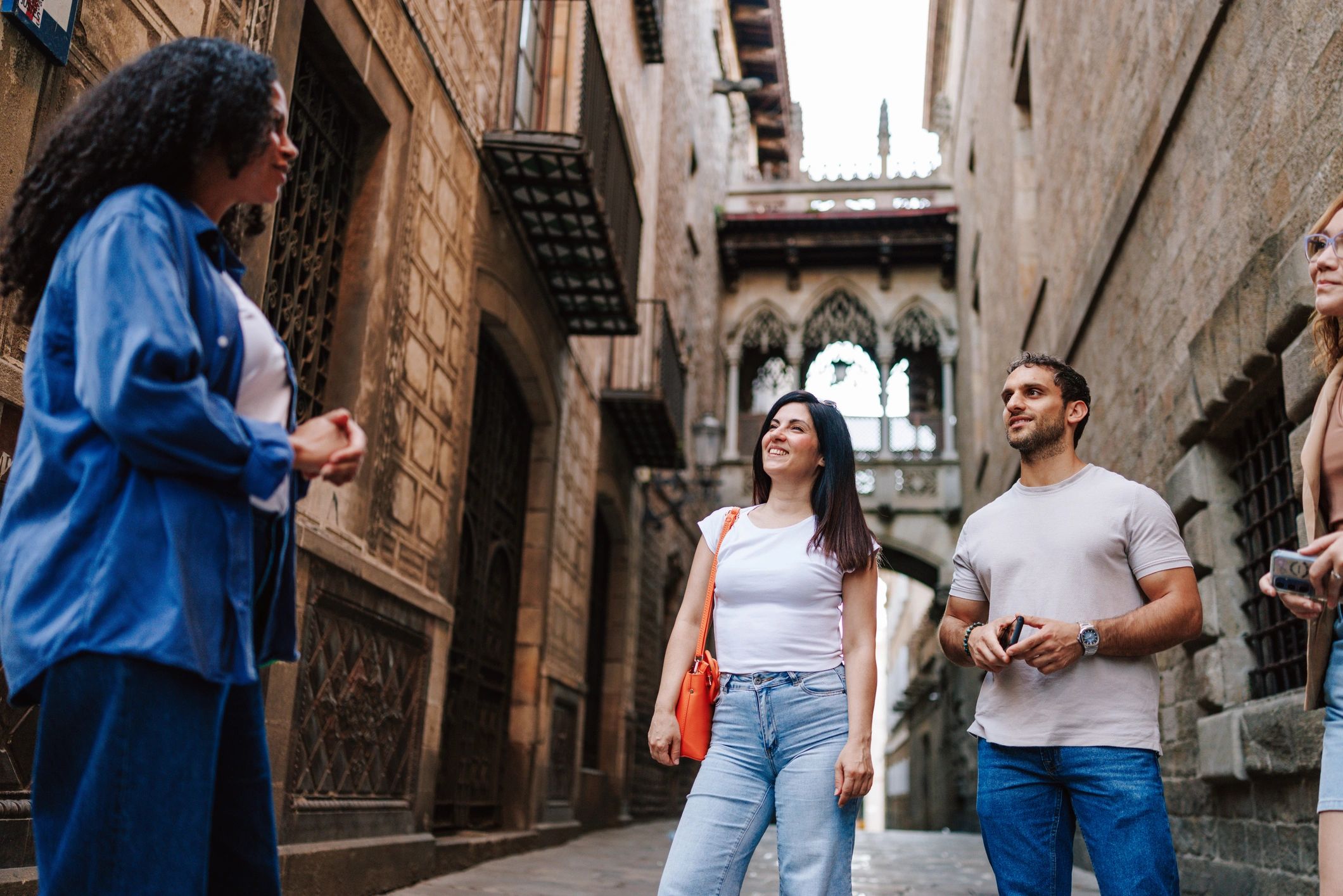 Tour guide speaking with visitors in Barcelona Gothic Quarter